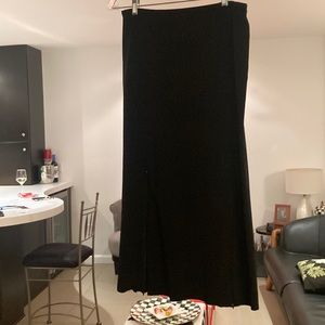 COS midi length black skirt.